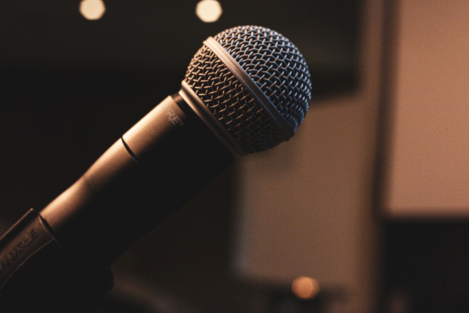 Podcast microphone and script notes in the recording booth